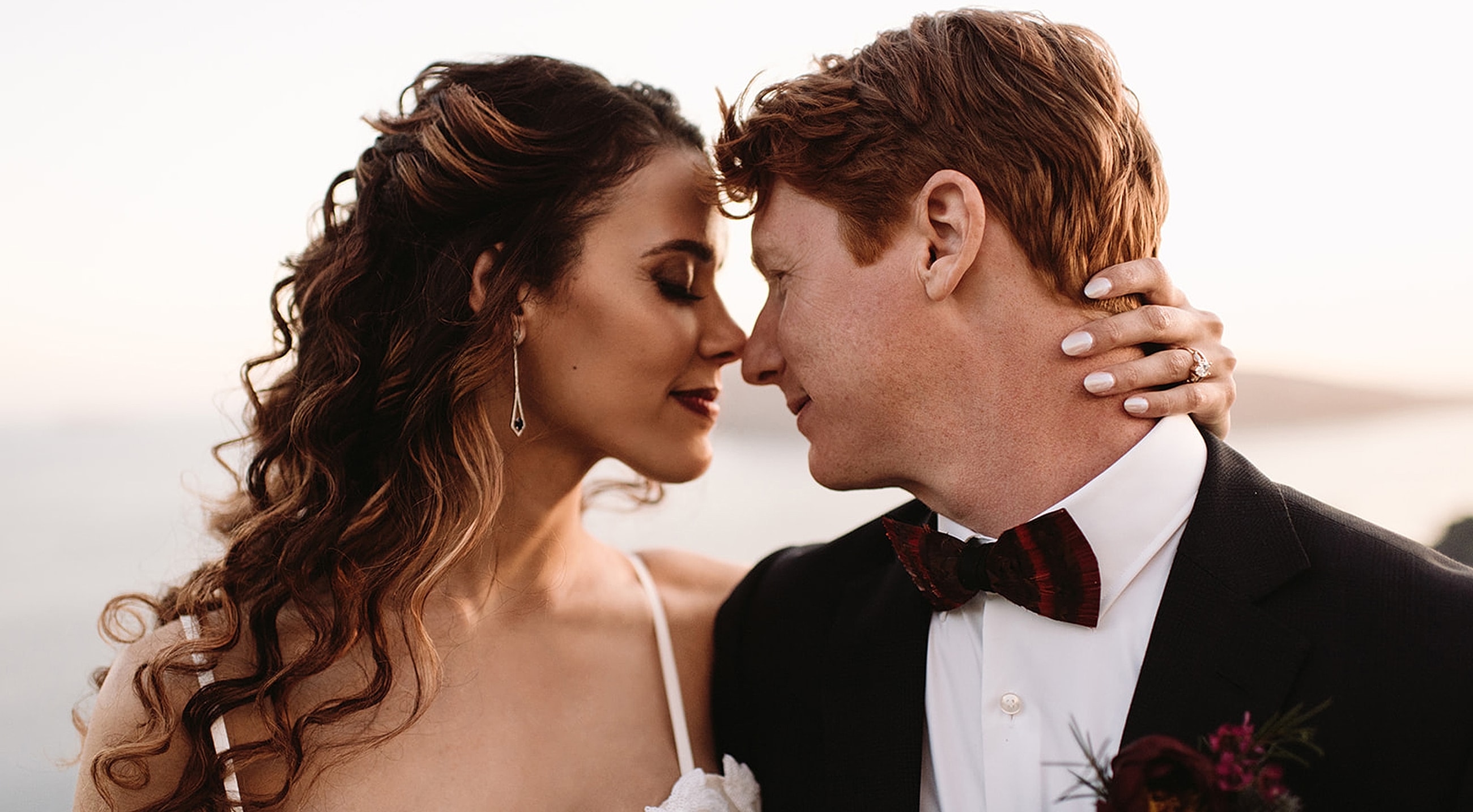 Couple sharing a romantic moment at sunset.